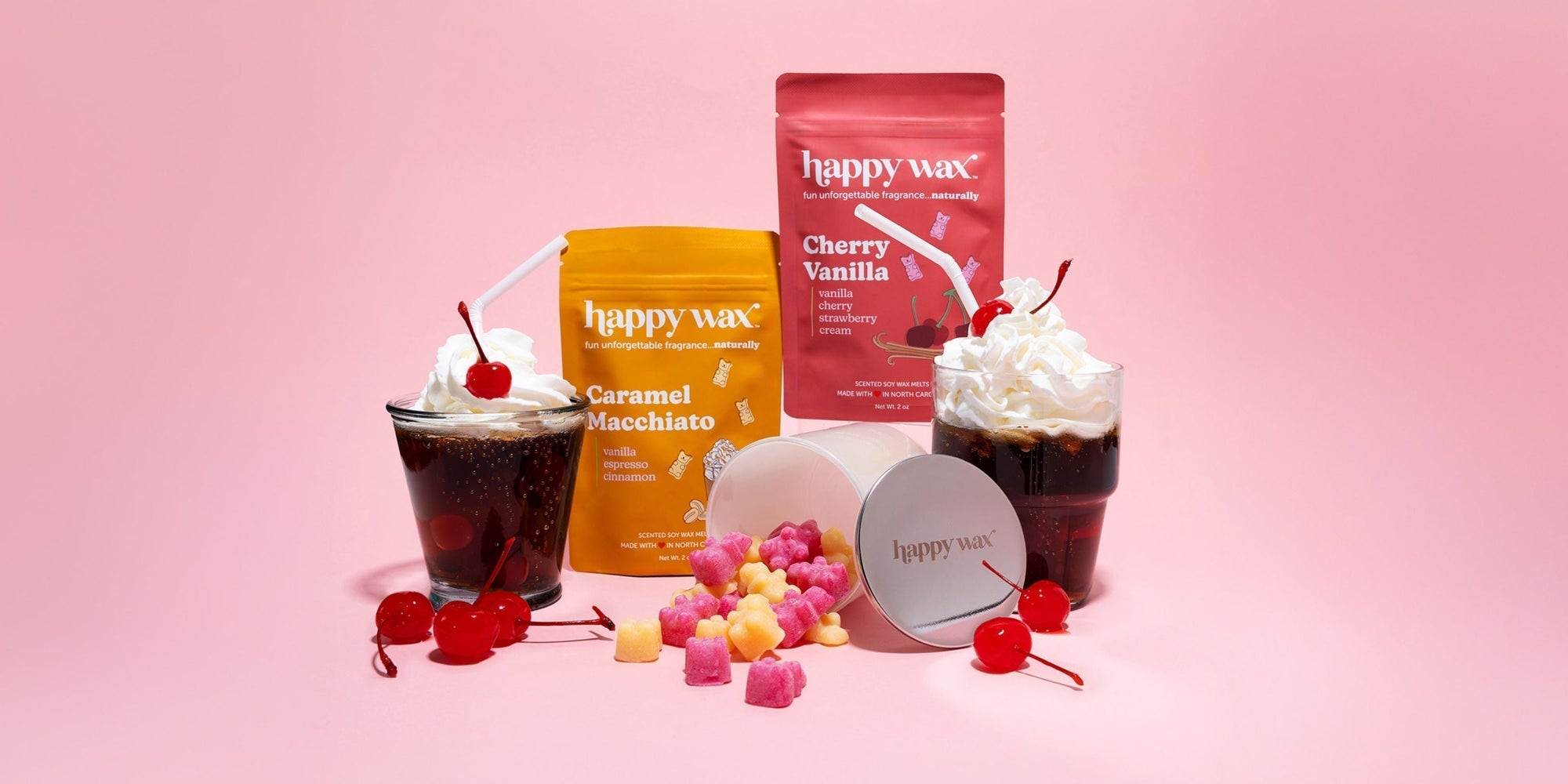 happy wax melt pouches with iridescent jar on pink background with soda floats and cherries