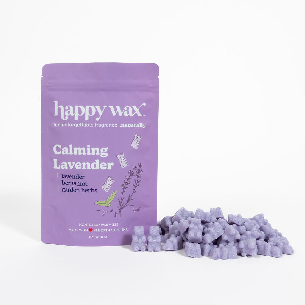 Purple wax melt pouch and lavender-colored wax chunks displayed on white background.