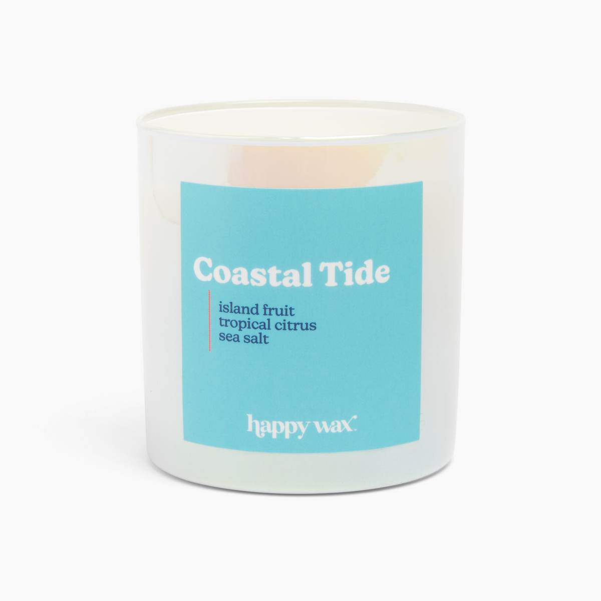 White cylindrical candle with turquoise label reading "Coastal Tide" and scent notes of island fruit, tropical citrus, and se