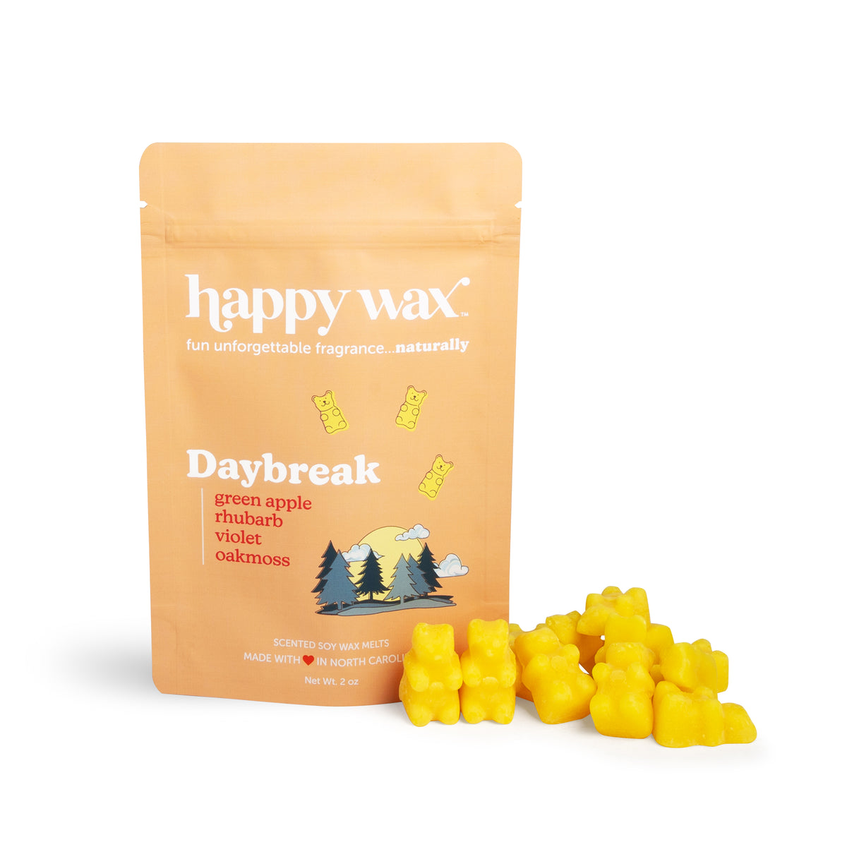 Peach-colored pouch of Daybreak wax melts with yellow wax melts scattered in front.