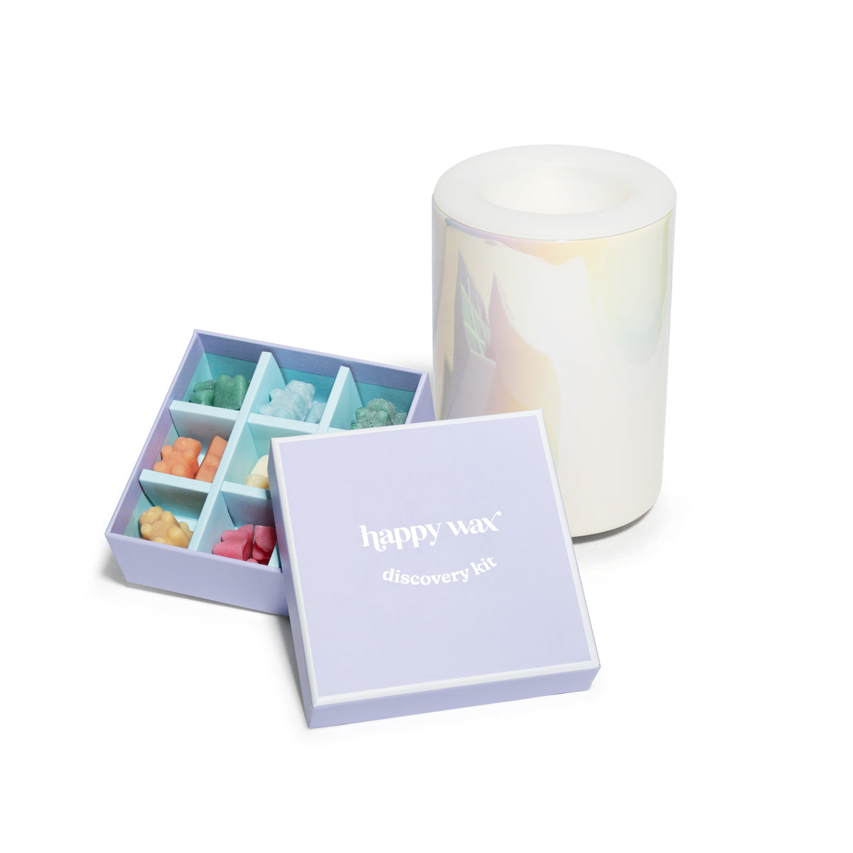 Lavender box containing nine colorful wax melts in various scents with white cylindrical warmer.