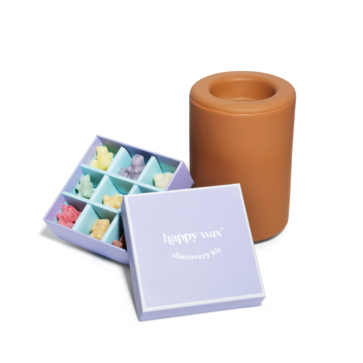 Lavender box containing assorted colored wax melts with terracotta wax melt warmer.