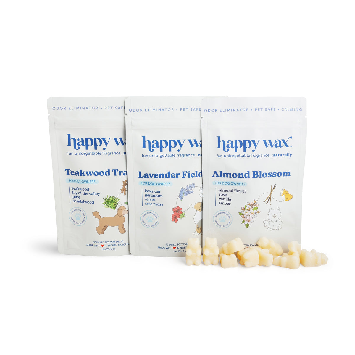 Three Happy Wax pouches labeled Teakwood Trail, Lavender Field, and Almond Blossom with scattered wax melts in front.