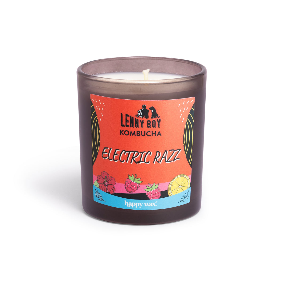Dark glass jar candle with single white wick and colorful label featuring raspberries and citrus fruit illustrations.