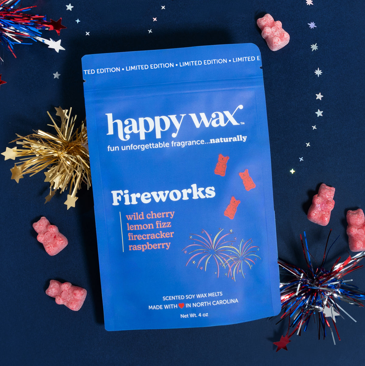 Happy Wax Fireworks packing with red wax bears and tinsel fireworks on a blue background.