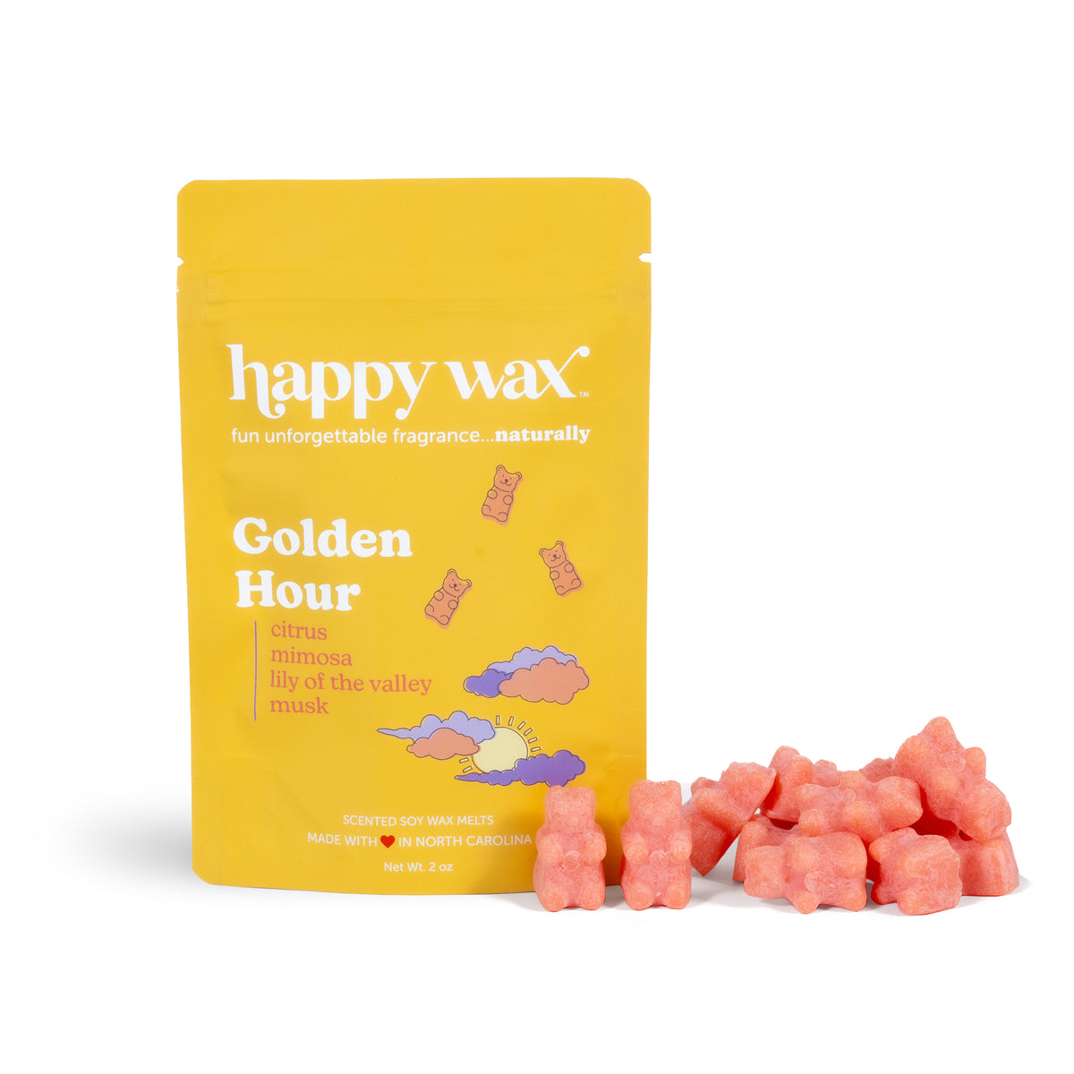 Yellow Happy Wax pouch with Golden Hour fragrance label next to coral-pink wax melts.
