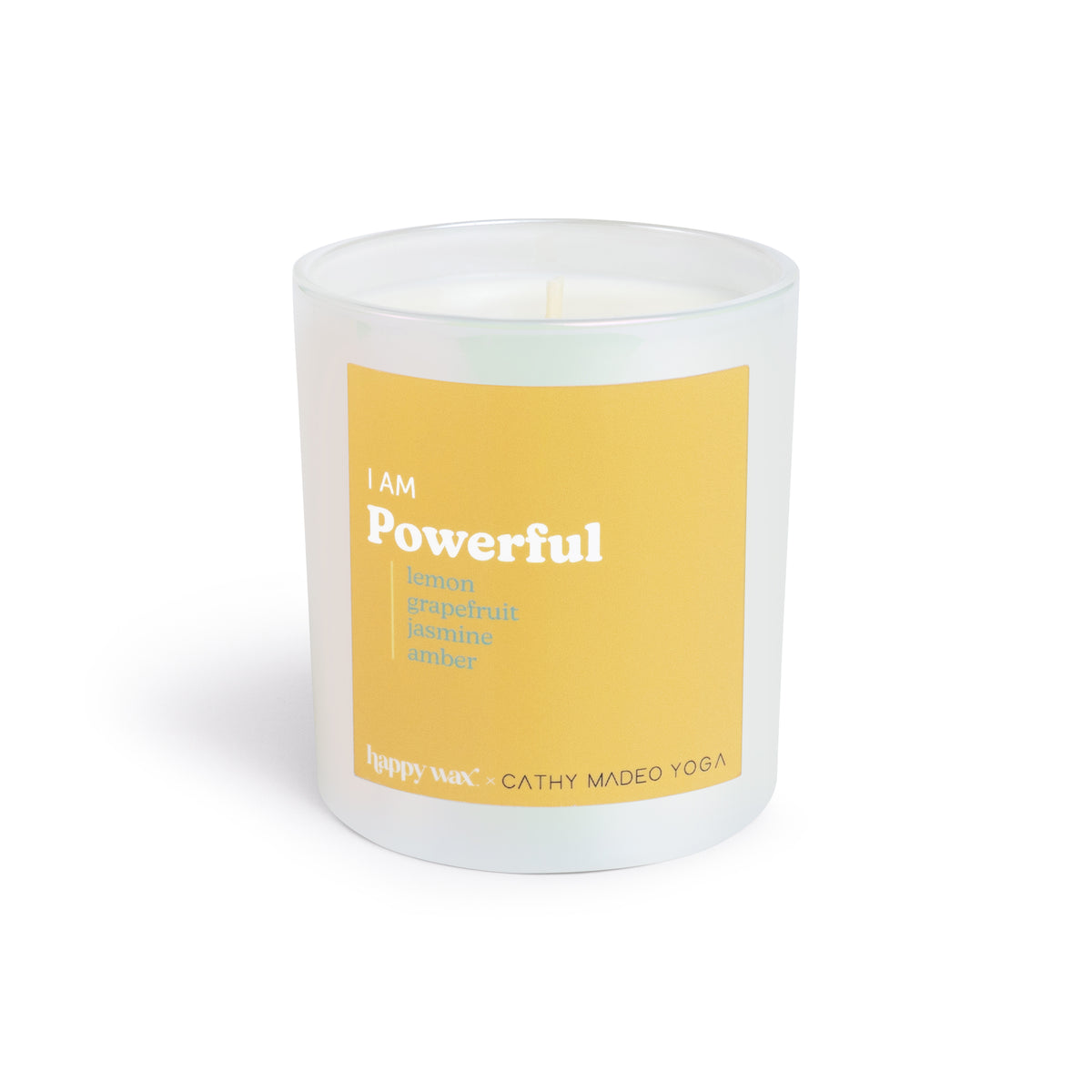 White cylindrical candle with yellow label reading "I AM Powerful" and scent notes of lemon, grapefruit, jasmine, and amber.