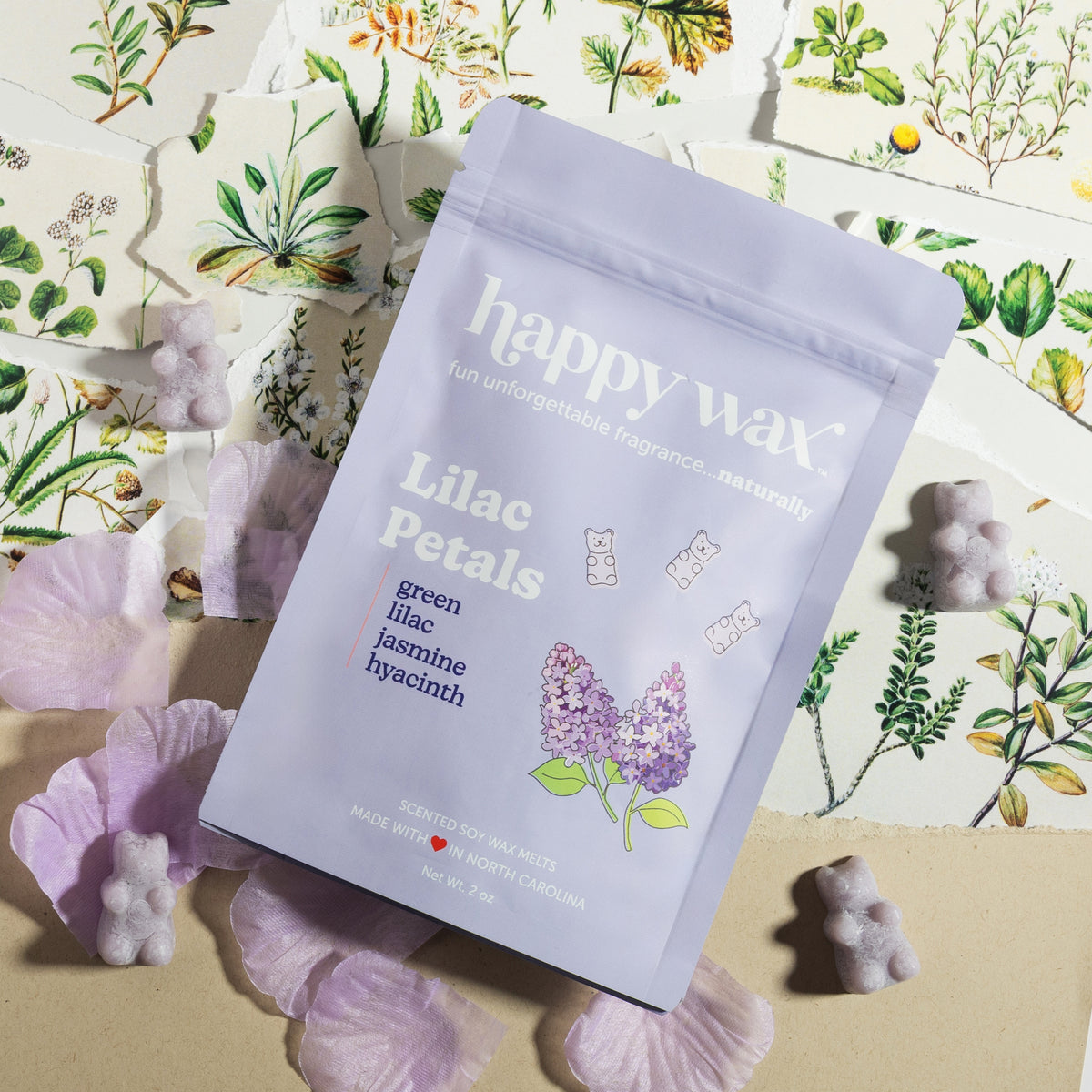 Lilac Petals wax melts package with purple bear-shaped melts and botanical print background.