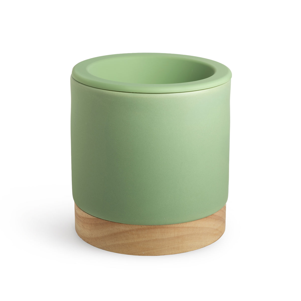 Cylindrical wax warmer with sage green ceramic body and natural wood base.