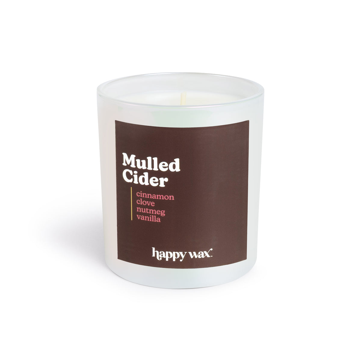 White glass candle jar with brown label reading "Mulled Cider" and single lit wick inside.