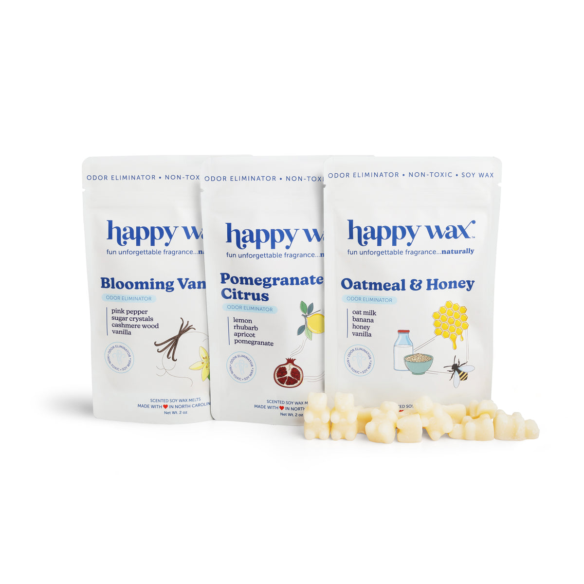 Three white pouches labeled "happy wax" in scents Blooming Vanilla, Pomegranate Citrus, and Oatmeal & Honey, with cream-color