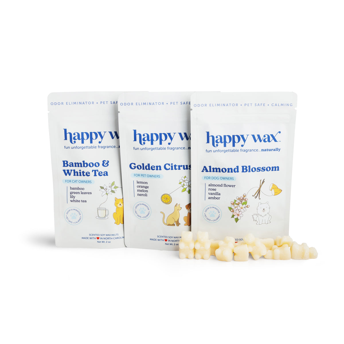 Three white pouches labeled Bamboo & White Tea, Golden Citrus, and Almond Blossom with wax melts scattered in front.