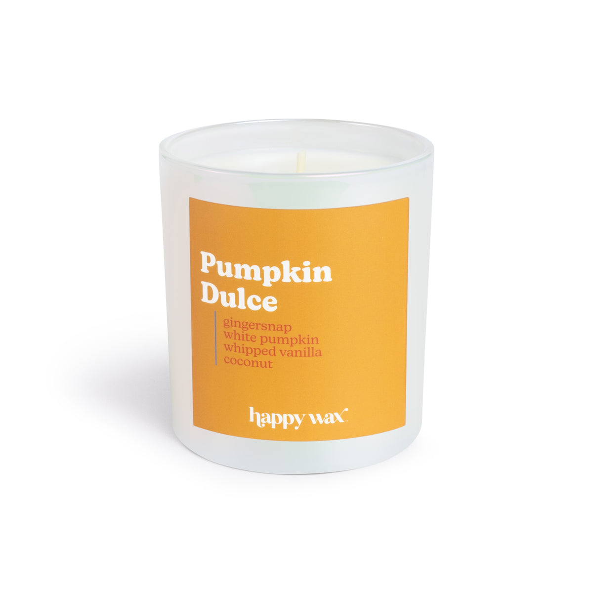 White cylindrical candle with orange label reading "Pumpkin Dulce" and single lit wick visible at top.