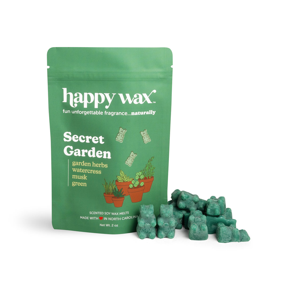 Green pouch of Happy Wax brand Secret Garden wax melts with scattered green wax cubes displayed beside it.