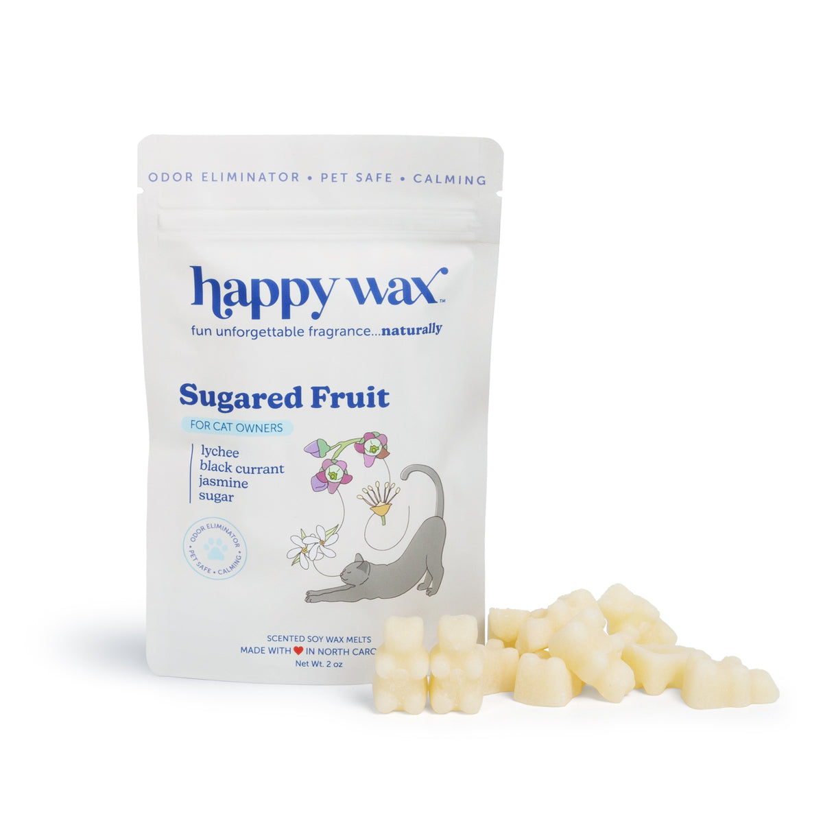 Cream-colored wax melts scattered next to white pouch labeled "happy wax Sugared Fruit" with cat illustration.
