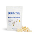 Happy Wax Almond Blossom soy wax melts in cream-colored chunks with product packaging showing almond flower, vanilla, and ros