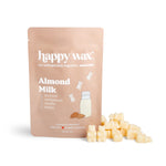 Cream-colored soy wax melts next to beige "happy wax" pouch labeled "Almond Milk" with almond and milk bottle graphics.