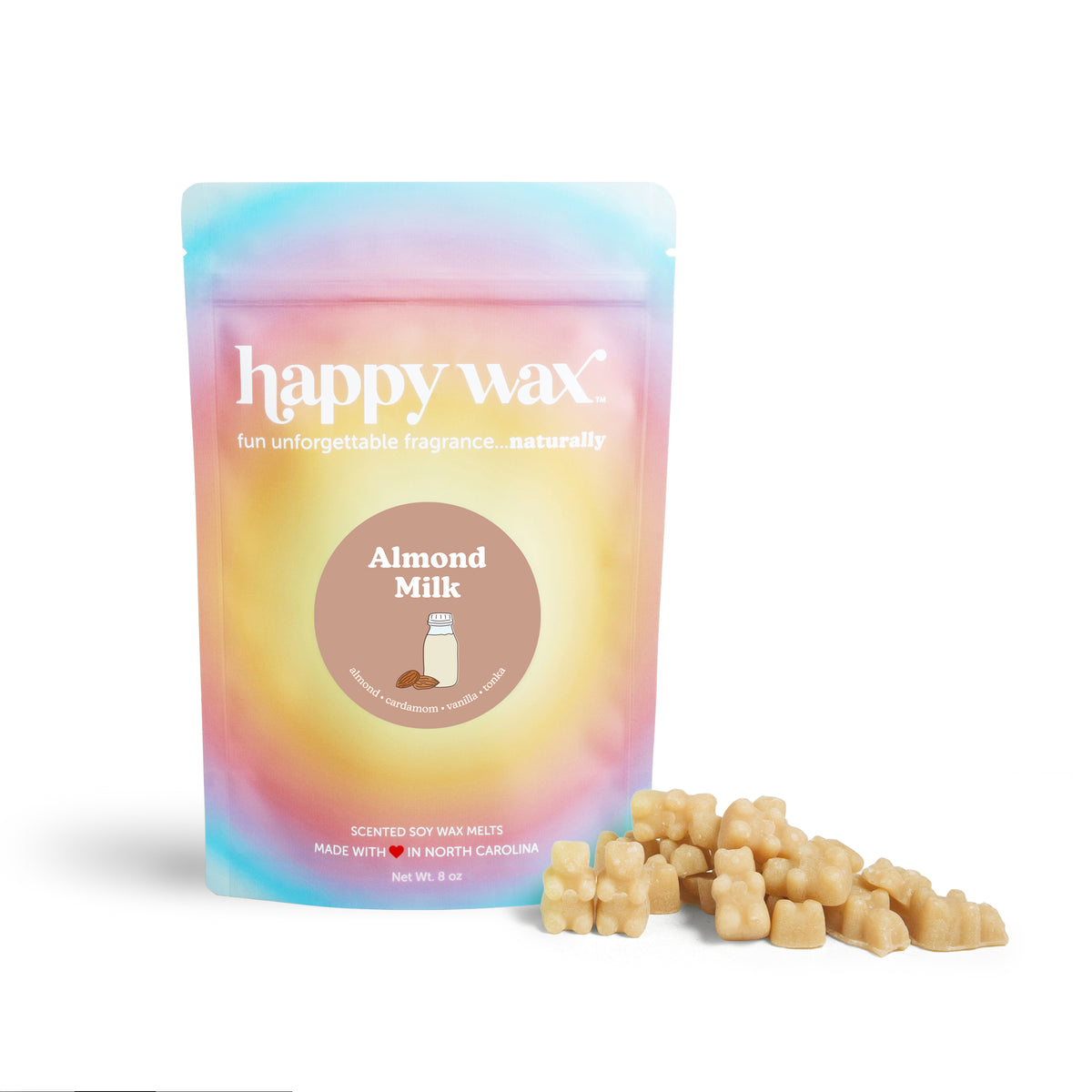Pastel gradient pouch of almond milk scented soy wax melts with tan-colored wax pieces displayed beside it.