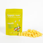 Bright yellow pouch of Happy Wax Amalfi wax melts with pile of yellow wax cubes displayed beside it.