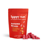 Red Happy Wax pouch of Autumn Breeze wax melts with pink wax cubes displayed beside it.