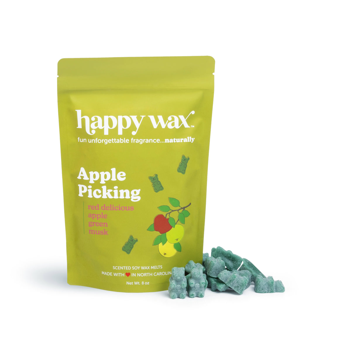 Green pouch of Happy Wax apple picking scented soy wax melts with illustrated apples, displayed next to green wax melt pieces