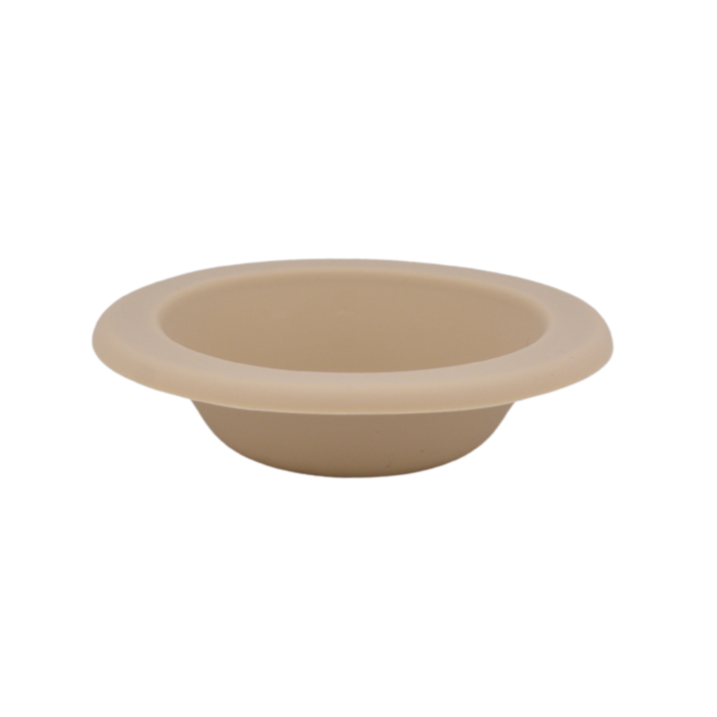 Beige silicone wax melt dish with wide rim and shallow bowl shape.