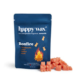 Blue pouch of Happy Wax Bonfire scented soy wax melts with coral-colored wax pieces displayed beside it.