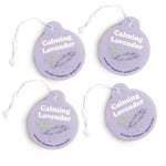 Four purple circular car charms with white strings, printed with "Calming Lavender" text and lavender plant illustrations.