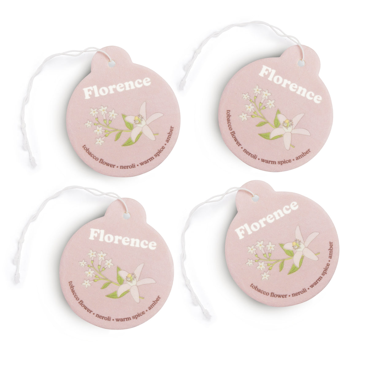 Four pink round car charms with "Florence" text, floral illustrations, and scent descriptions with attached string loops.