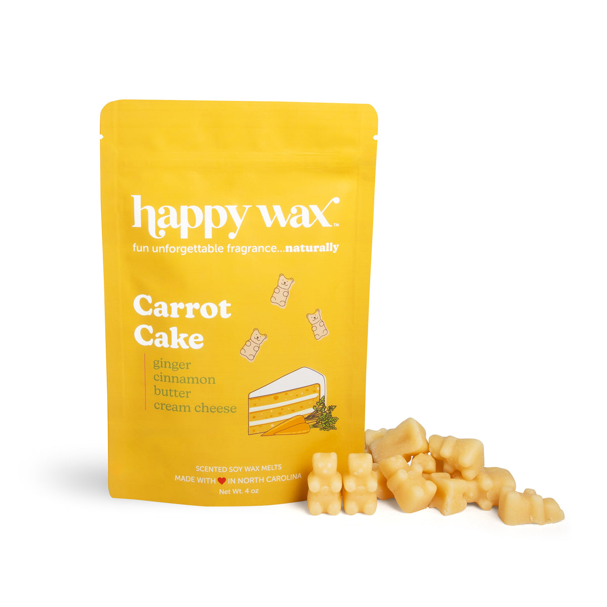 Yellow pouch of happy wax brand carrot cake wax melts with cream-colored wax melts displayed in front.