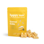 Yellow pouch of Happy Wax Carrot Cake scented soy wax melts with cream-colored wax cubes displayed beside it.