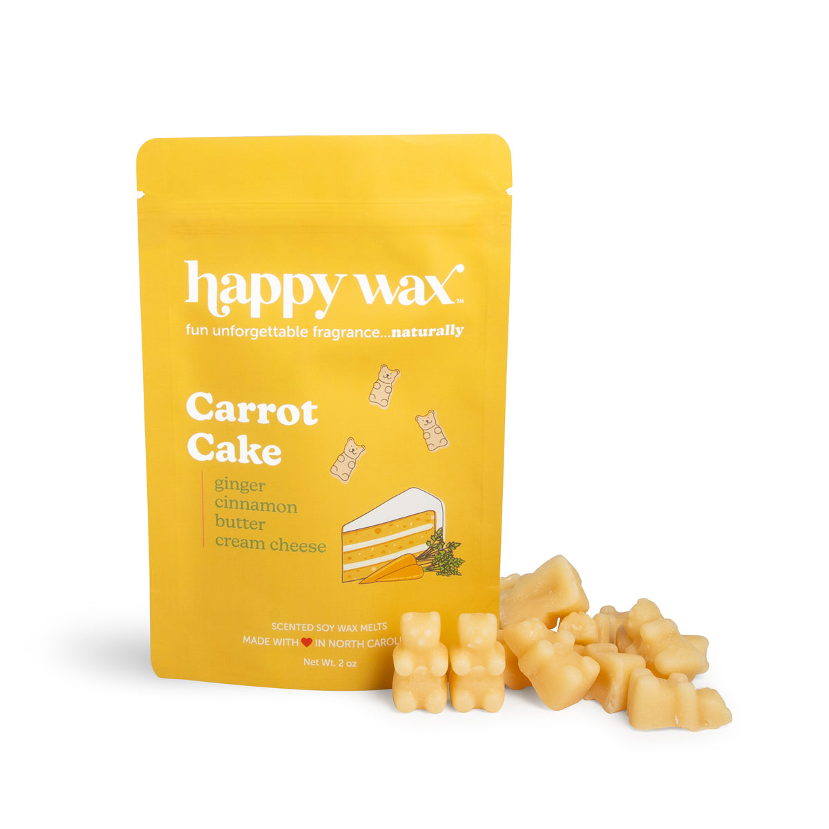 Yellow pouch of Happy Wax Carrot Cake scented soy wax melts with cream-colored wax cubes displayed beside it.
