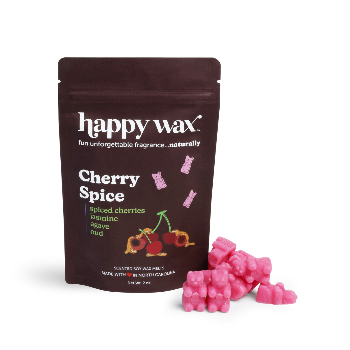 Dark brown pouch of Happy Wax Cherry Spice wax melts with pink wax pieces scattered beside it.