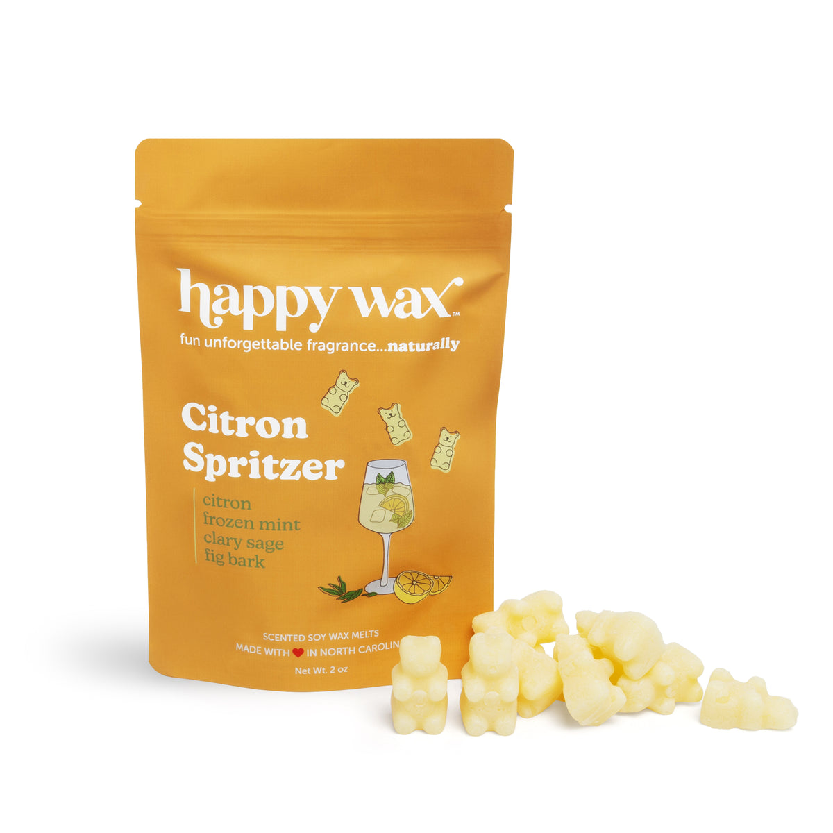 Yellow wax melts scattered beside a gold pouch labeled "Citron Spritzer" with cocktail and citrus illustrations.