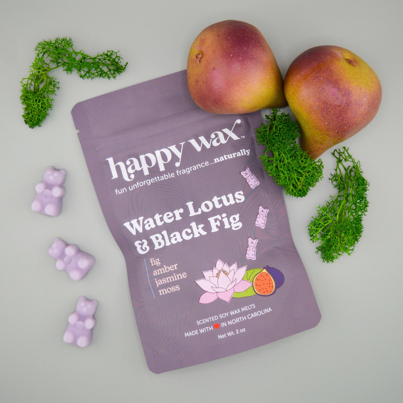 Purple Happy Wax package of Water Lotus & Black Fig wax melts with lavender melts, fresh figs, and green moss.