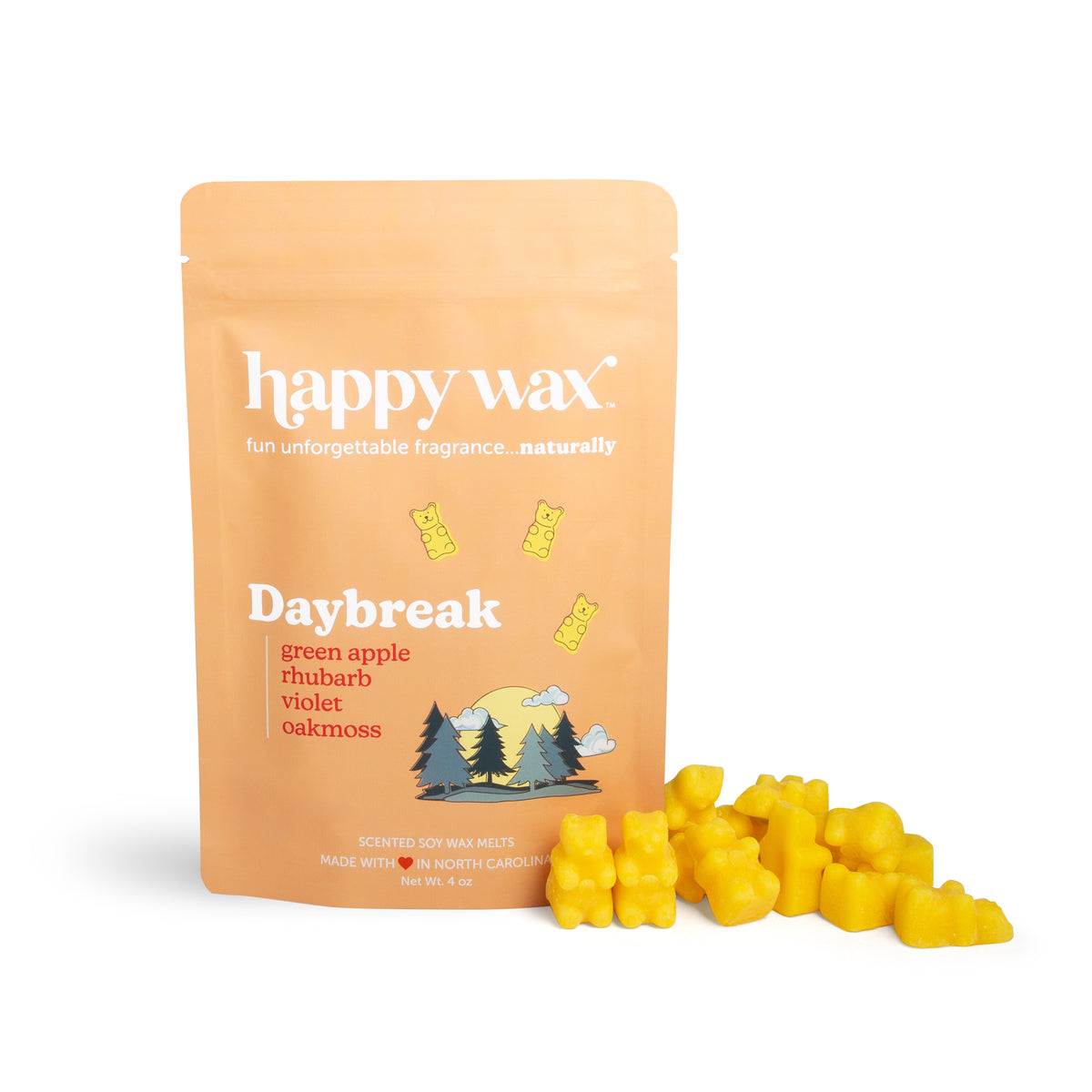 Peach-colored pouch of Happy Wax Daybreak soy wax melts with yellow wax melts scattered in front.