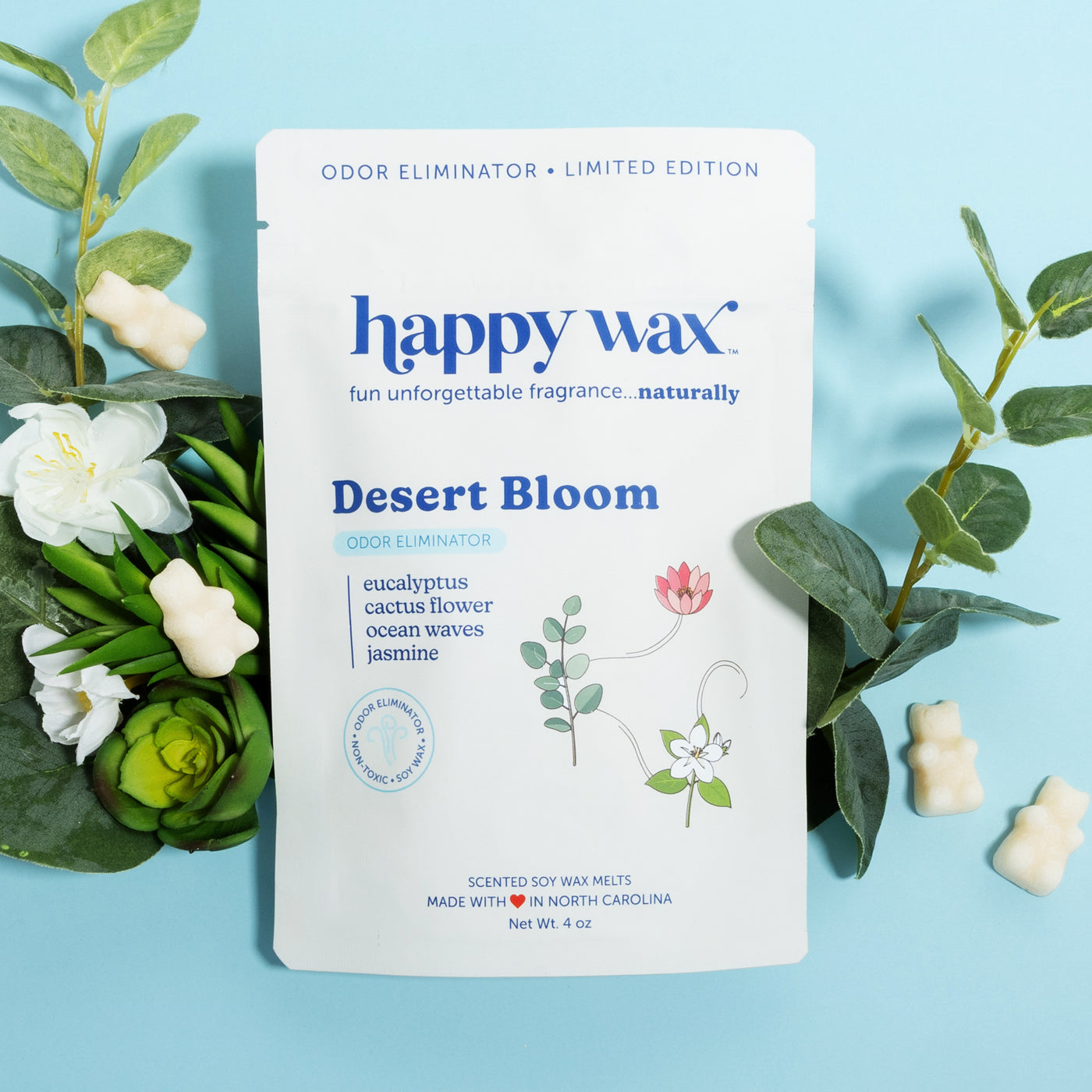 Happy Wax Desert Bloom packaging with white bears, eucalyptus, white flowers and succulents on blue background