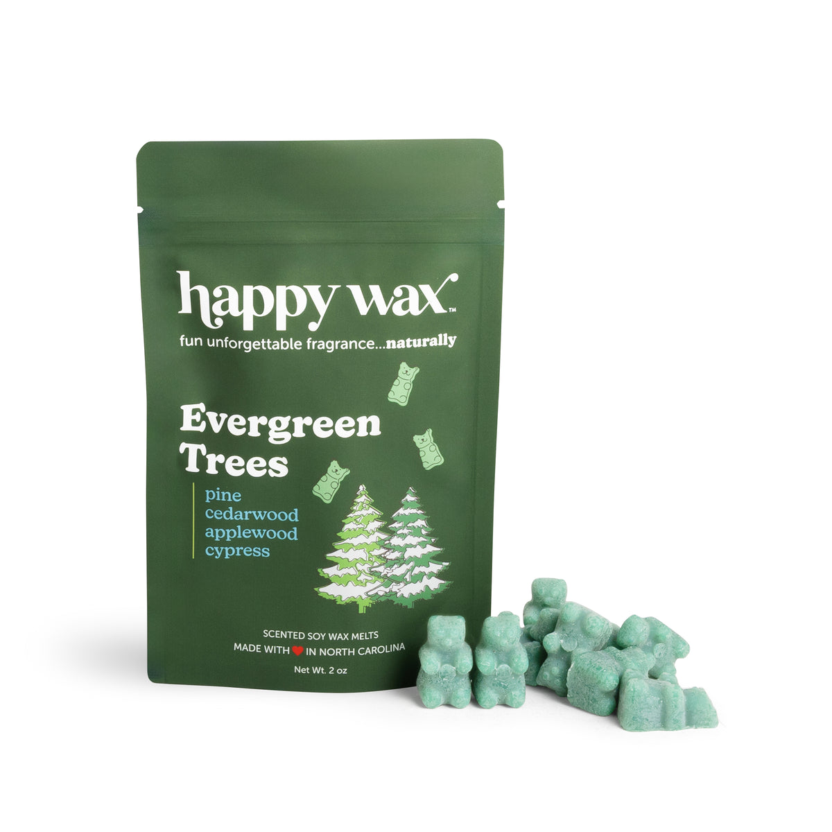 Green resealable pouch of happy wax Evergreen Trees soy wax melts with scattered light green wax pieces beside it.