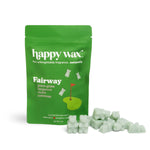 Green Happy Wax pouch labeled Fairway with pale green wax melts scattered in front.