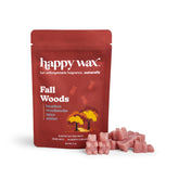 Red pouch of Happy Wax Fall Woods soy wax melts with pink wax chunks displayed in front.