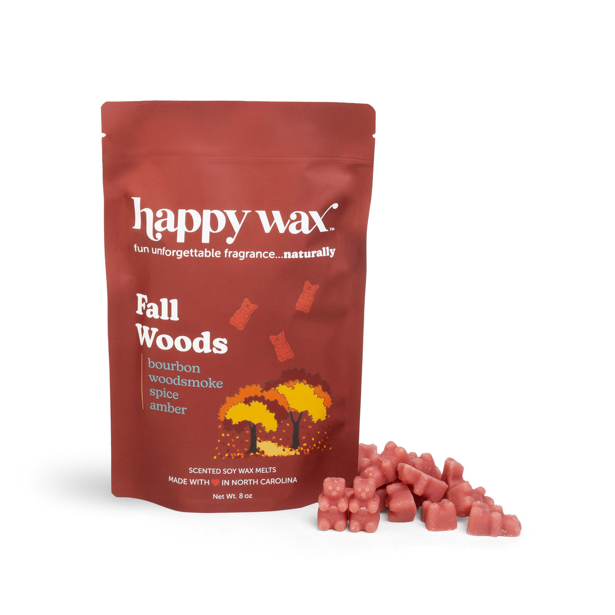 Red pouch of Happy Wax Fall Woods soy wax melts with scattered pink wax cubes displayed beside it.