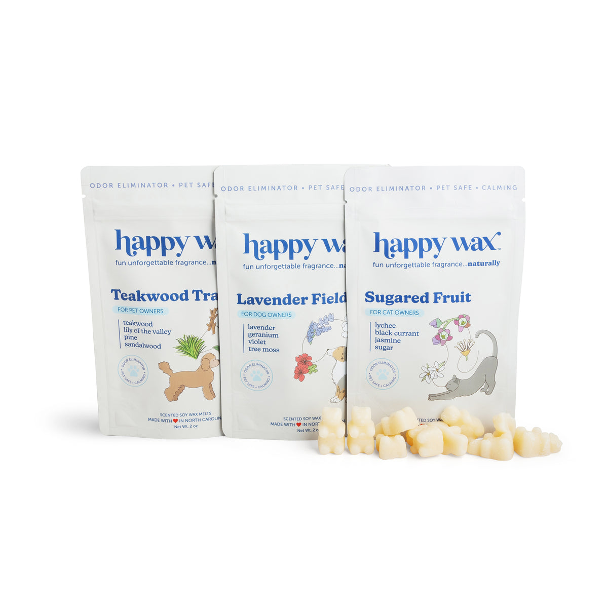 Three happy wax pouches labeled Teakwood Trail, Lavender Field, and Sugared Fruit with wax melts displayed in front.