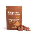 Brown Happy Wax pouch labeled Gingerbread with scattered terracotta-colored wax melts beside it.
