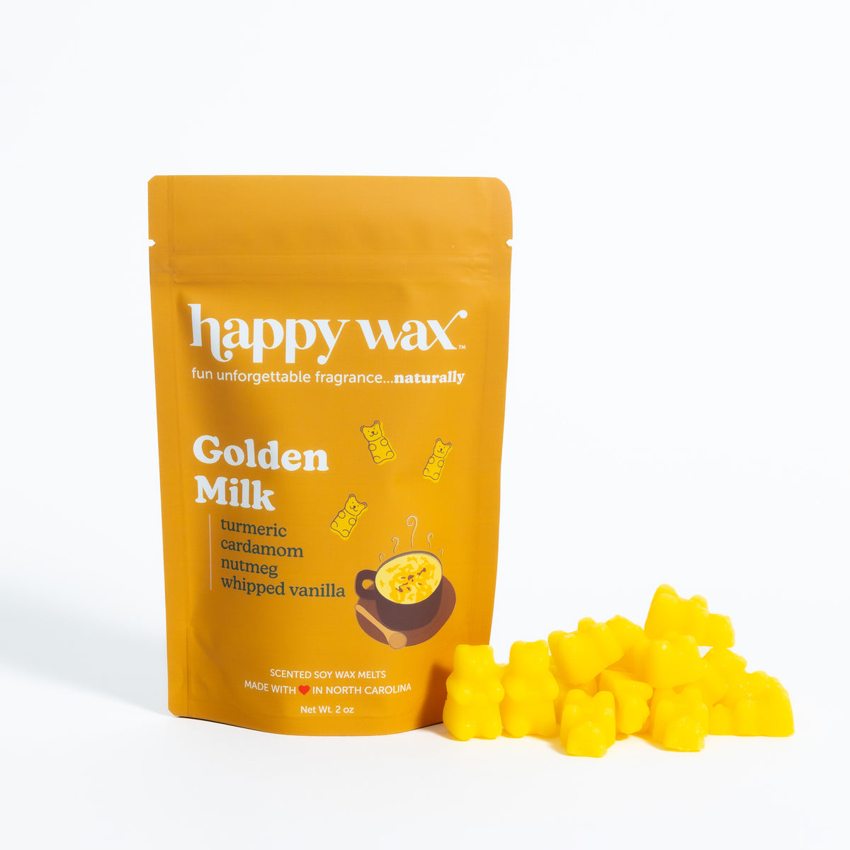 Gold pouch of Happy Wax brand Golden Milk scented soy wax melts with loose yellow wax pieces displayed beside it.