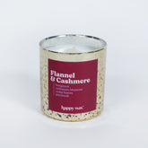 Cream speckled candle with burgundy label reading "Flannel & Cashmere" and single white wick, by Happy Wax.