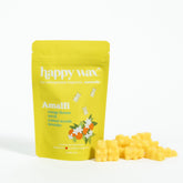 Yellow pouch of Happy Wax Amalfi wax melts with scattered yellow wax melts displayed beside it.