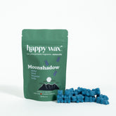 Green pouch of Happy Wax Moonshadow wax melts with blue wax pieces displayed beside it.
