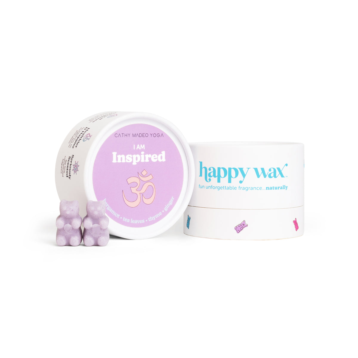 Purple wax melts in a container labeled "I am Inspired" by Cathy Madeo Yoga next to a Happy Wax branded box.