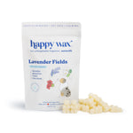 White pouch of Happy Wax Lavender Fields pet wax melts with cream-colored wax pieces scattered beside it.