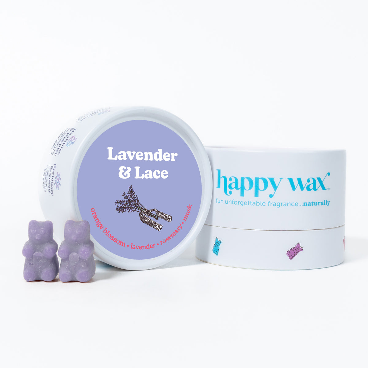 Purple wax melts shaped like bears next to a lavender-labeled container and branded happy wax box.